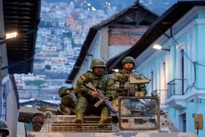 Soldiers in an armoured vehicle patrol the city's historic centre following an outbreak of violence a day after Ecuador's President Daniel Noboa declared a 60-day state of emergency following the disappearance of Adolfo Macias, leader of the Los Choneros criminal gang, from the prison where he was serving a 34-year sentence, in Quito, Ecuador, January 9, 2024. REUTERS/Karen Toro     TPX IMAGES OF THE DAY