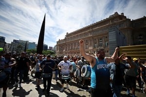 Demonstrators protest against Argentina's new President Javier Milei's economic reforms, outside the Teatro Colon opera house, near the Justice Palace in Buenos Aires, Argentina December 27, 2023. REUTERS/Agustin Marcarian