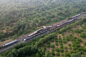 A drone view shows heavy machinery removing damaged coaches following a collision between two passenger trains in Vizianagaram district in the southern Andhra Pradesh state, India, October 30, 2023. REUTERS/R.Narendra NO RESALES. NO ARCHIVES